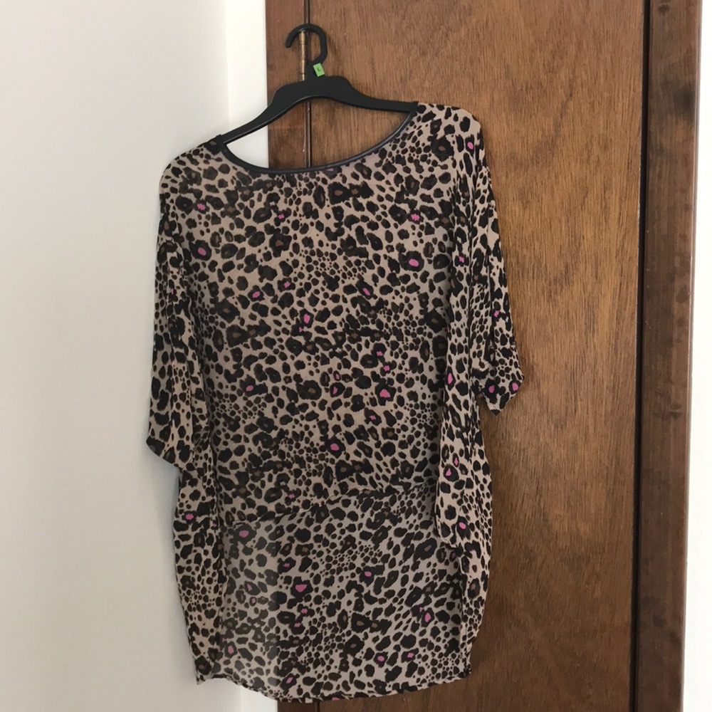 Leopard print poncho blouse with pink accents